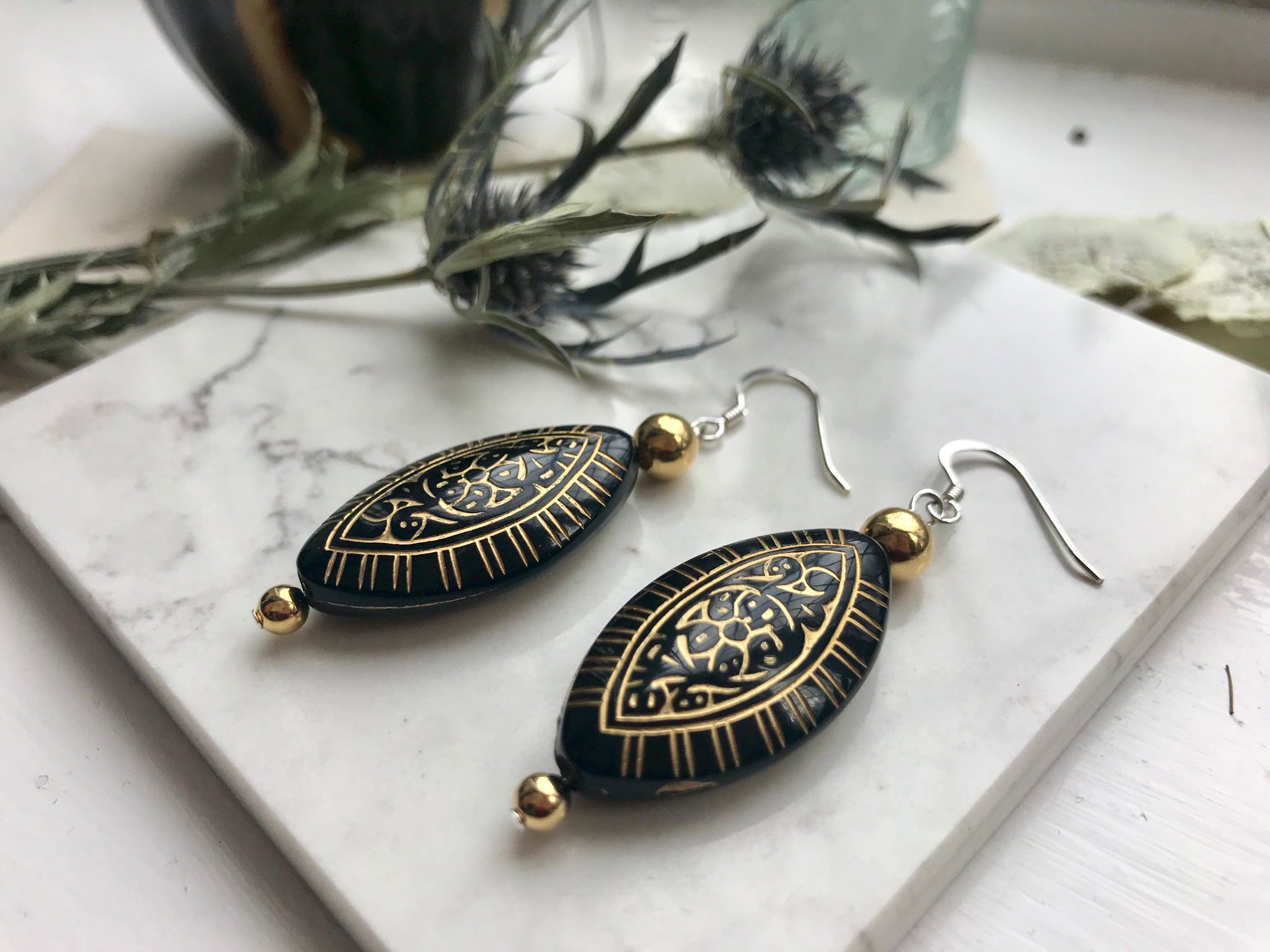 Black and gold detailed earrings