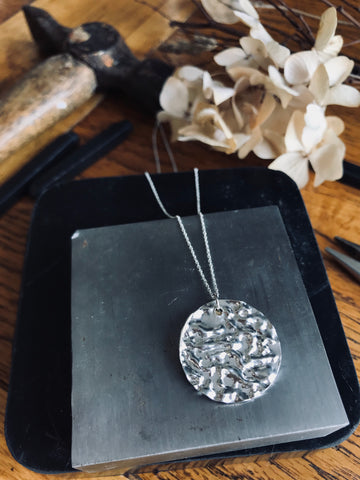 Sterling silver hammered effect disc