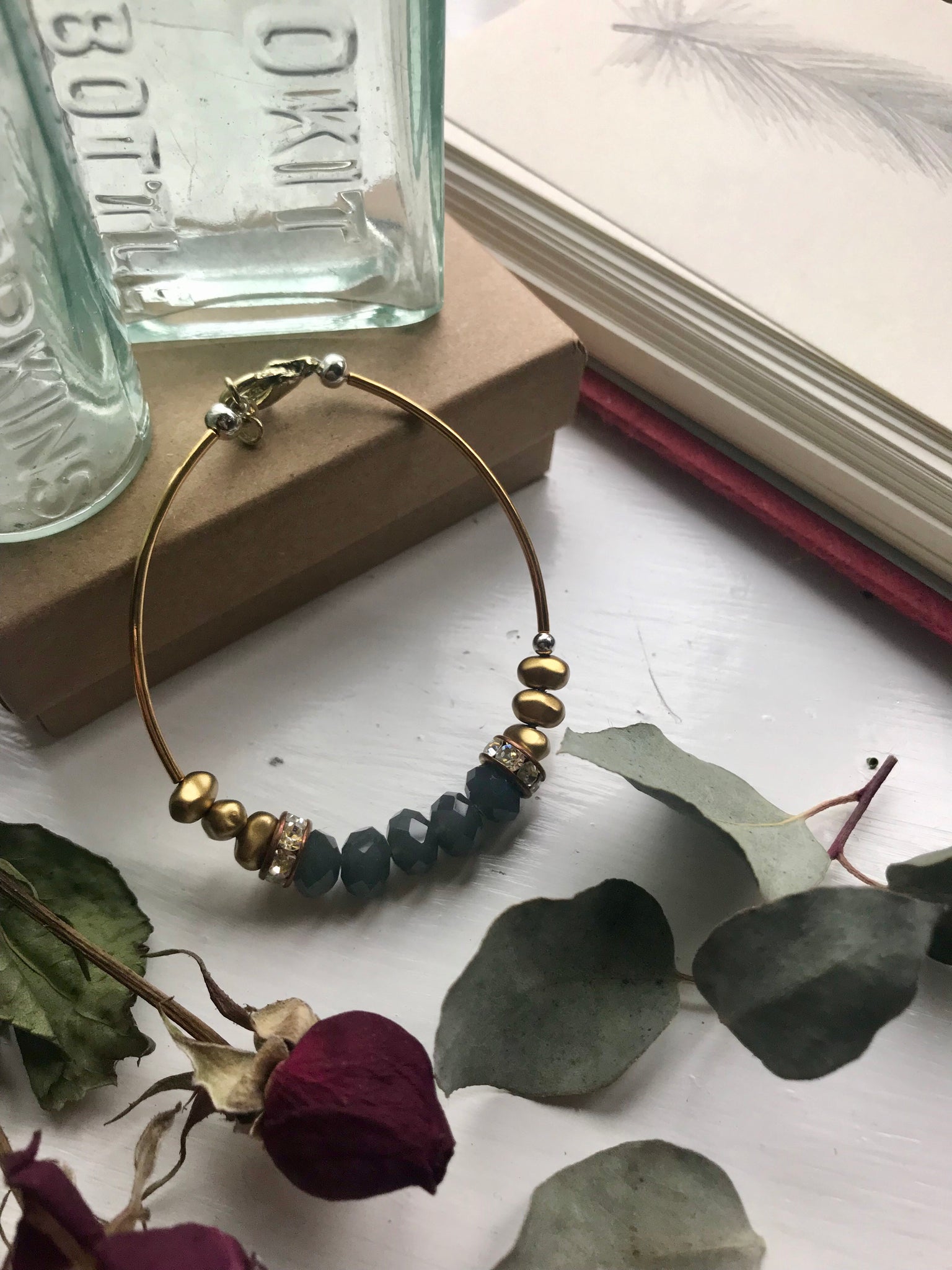 Gold, silver and blue tone bracelet