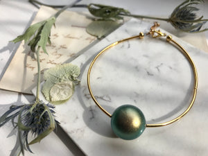Swarovski iridescent green and gold bracelet