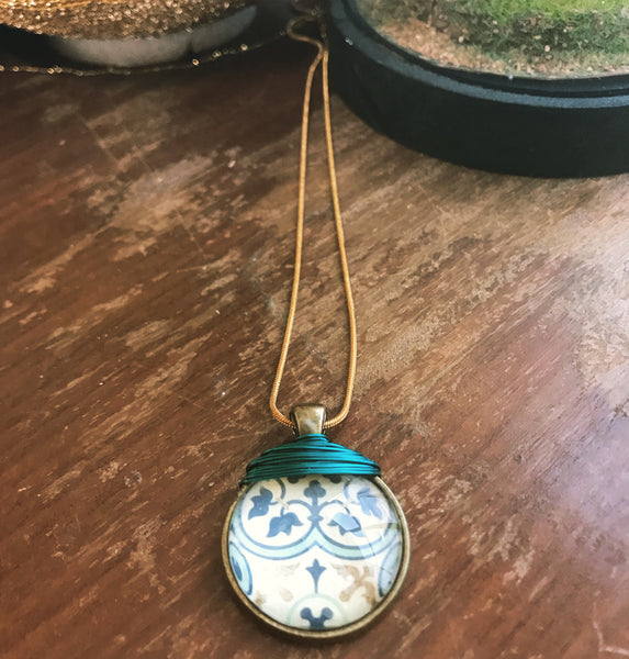 Tile print pendant with turquoise wire detailing