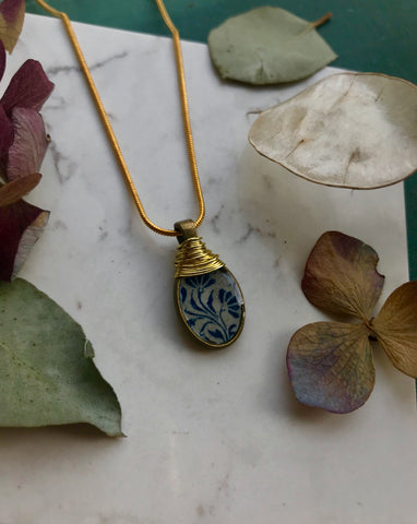 Blue vintage print necklace with gold detailing