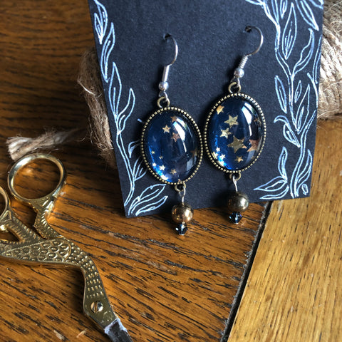 Blue and gold star earrings