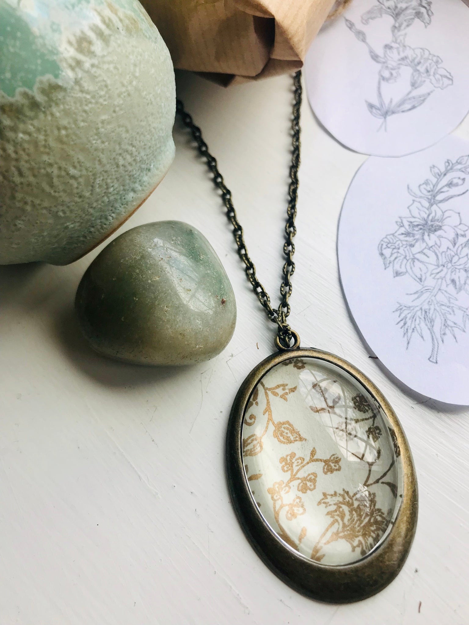 Gold and cream vintage print pendant