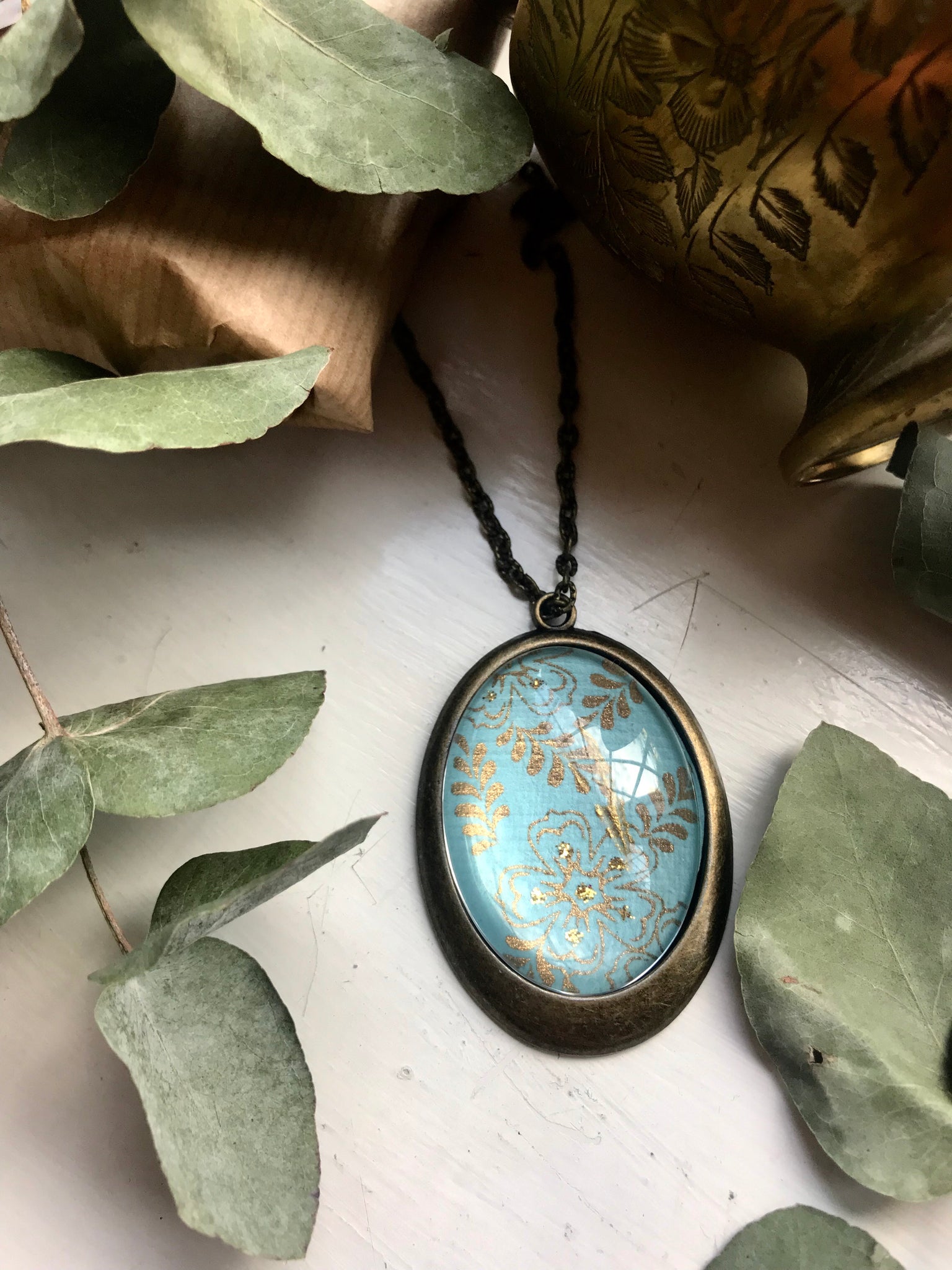 Blue and gold floral pendant